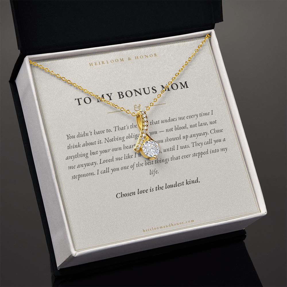 Gold alluring beauty necklace on Bonus Mom card angled in white gift box